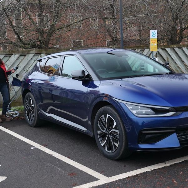 Ginny Buckley plugging an an electric Kia EV6 at a Shell chargepoint